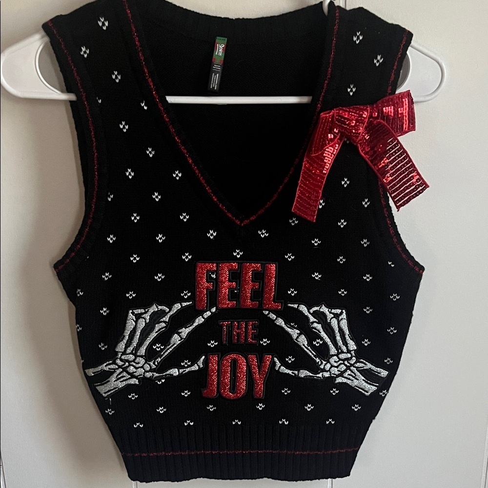 Black Sleeveless Top with Red Bow